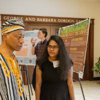 Hemalatha Sabbineni showing her research to a professor